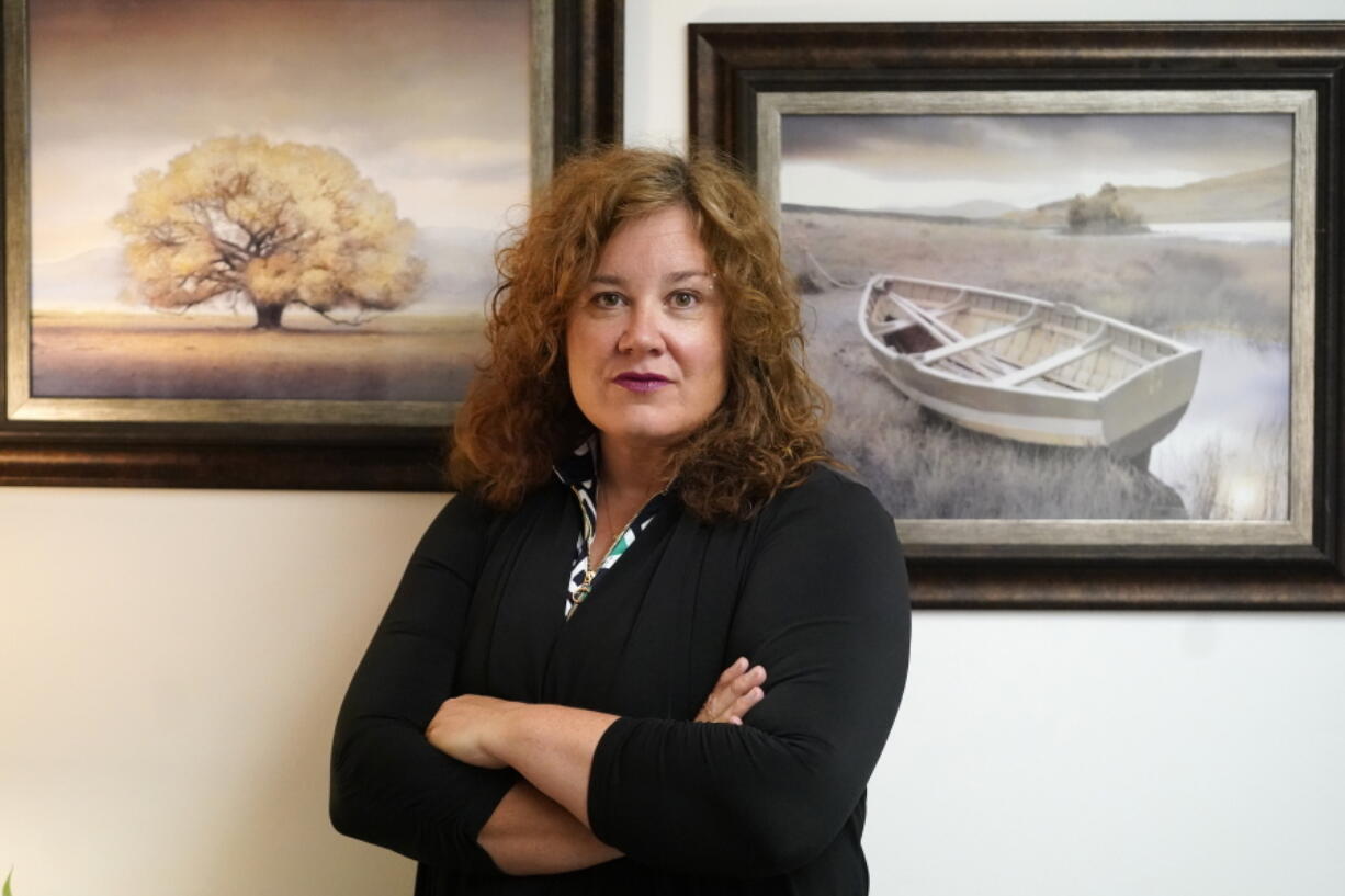 Natasha Helfer poses for a portrait, Monday, June 7, 2021, in Holladay, Utah. A decision by The Church of Jesus Christ of Latter-day Saints to kick out Helfer, a sex therapist who had publicly challenged the faith's policies on sexuality, has triggered concerns from mental health professionals. They fear the move will further embolden a culture of shame that stops church members from seeking help.