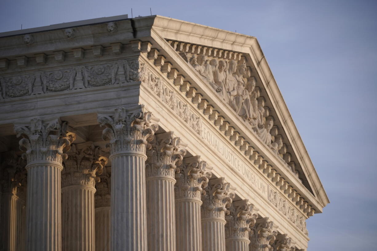 FILE - In this Nov. 5, 2020, file photo the Supreme Court is seen in Washington. With abortion and guns already on the agenda, the conservative-dominated Supreme Court is considering adding a third blockbuster issue -- whether to ban consideration of race in college admissions.  (AP Photo/J.