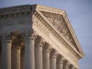 FILE - In this Nov. 5, 2020, file photo the Supreme Court is seen in Washington. With abortion and guns already on the agenda, the conservative-dominated Supreme Court is considering adding a third blockbuster issue -- whether to ban consideration of race in college admissions.  (AP Photo/J.