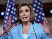 Speaker of the House Nancy Pelosi, D-Calif., talks to reporters just after the Supreme Court dismissed a challenge to the Obama-era health care law, at the Capitol in Washington, Thursday, June 17, 2021. (AP Photo/J.