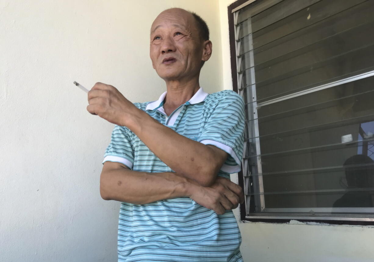 Fan Baolin, who served 17 years in prison and says he sneaked out of China last year to escape constant surveillance, poses during an interview in an undisclosed location and on an undisclosed date. The ruling Communist Party's deadly 1989 crackdown on the Tiananmen Square pro-democracy protests never ended for Fan and others who still are watched by the party three decades later in an effort to erase the public memory of the protests.