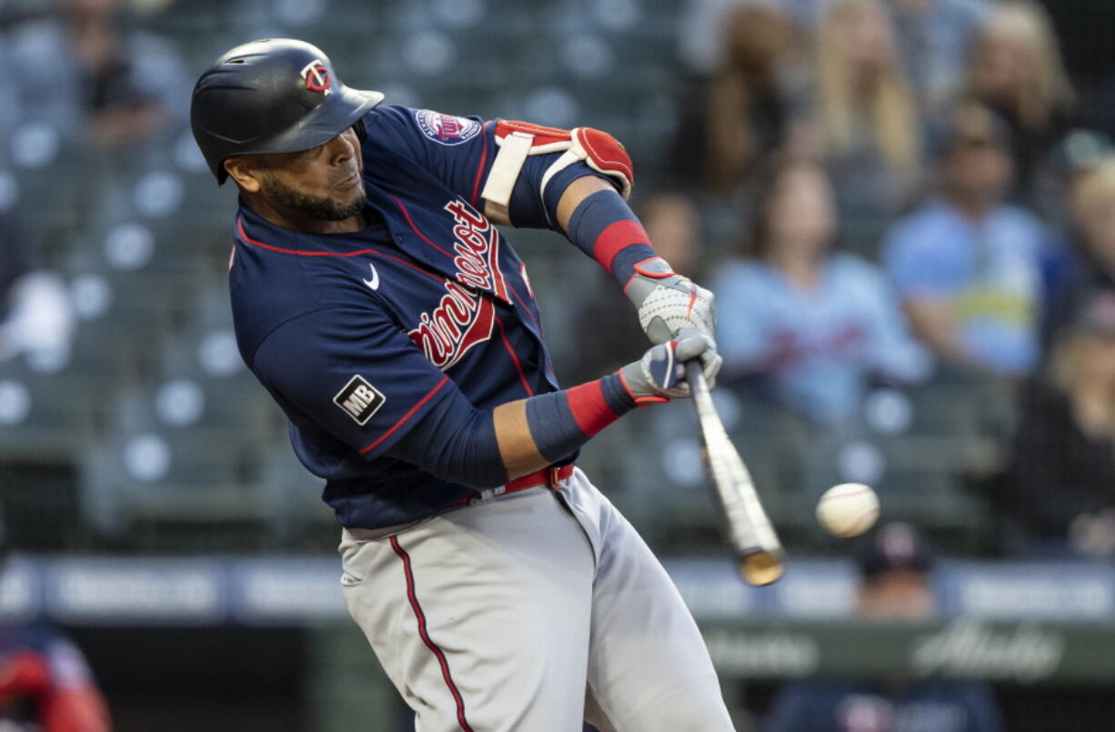 Minnesota Twins' Nelson Cruz hits a three-run home run off Seattle Mariners starting pitcher Justus Sheffieldvduring the fifth inning of a baseball game Wednesday, June 16, 2021, in Seattle.