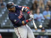 Minnesota Twins' Nelson Cruz hits a three-run home run off Seattle Mariners starting pitcher Justus Sheffieldvduring the fifth inning of a baseball game Wednesday, June 16, 2021, in Seattle.