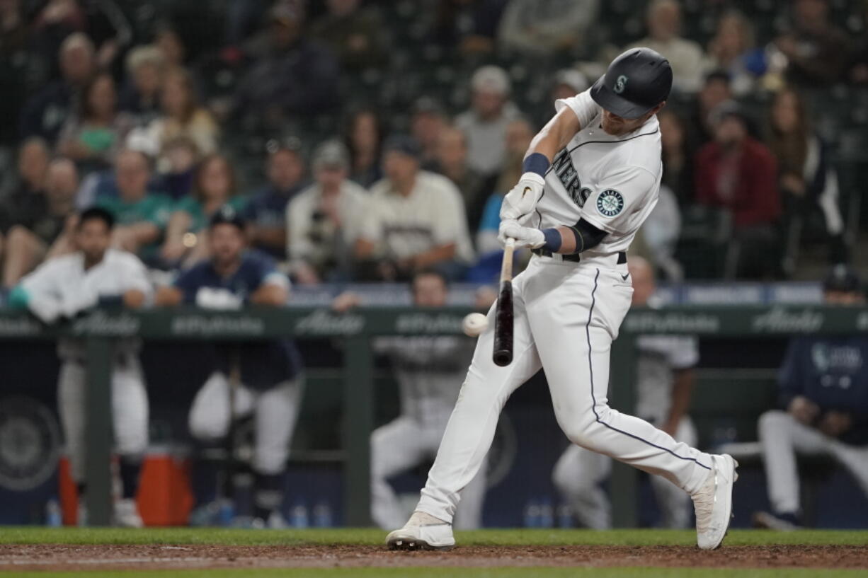 Seattle Mariners' Jake Bauers hits a go-ahead solo home run against the Minnesota Twins during the eighth inning of a baseball game, Monday, June 14, 2021, in Seattle. (AP Photo/Ted S.