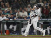 Seattle Mariners' Jake Bauers hits a go-ahead solo home run against the Minnesota Twins during the eighth inning of a baseball game, Monday, June 14, 2021, in Seattle. (AP Photo/Ted S.