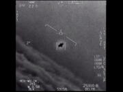 The image from video provided by the Department of Defense labelled Gimbal, from 2015, an unexplained object is seen at center as it is tracked as it soars high along the clouds, traveling against the wind. "There's a whole fleet of them," one naval aviator tells another, though only one indistinct object is shown. "It's rotating." The U.S. government has been taking a hard look at unidentified flying objects, under orders from Congress, and a report summarizing what officials know is expected to come out in June 2021.