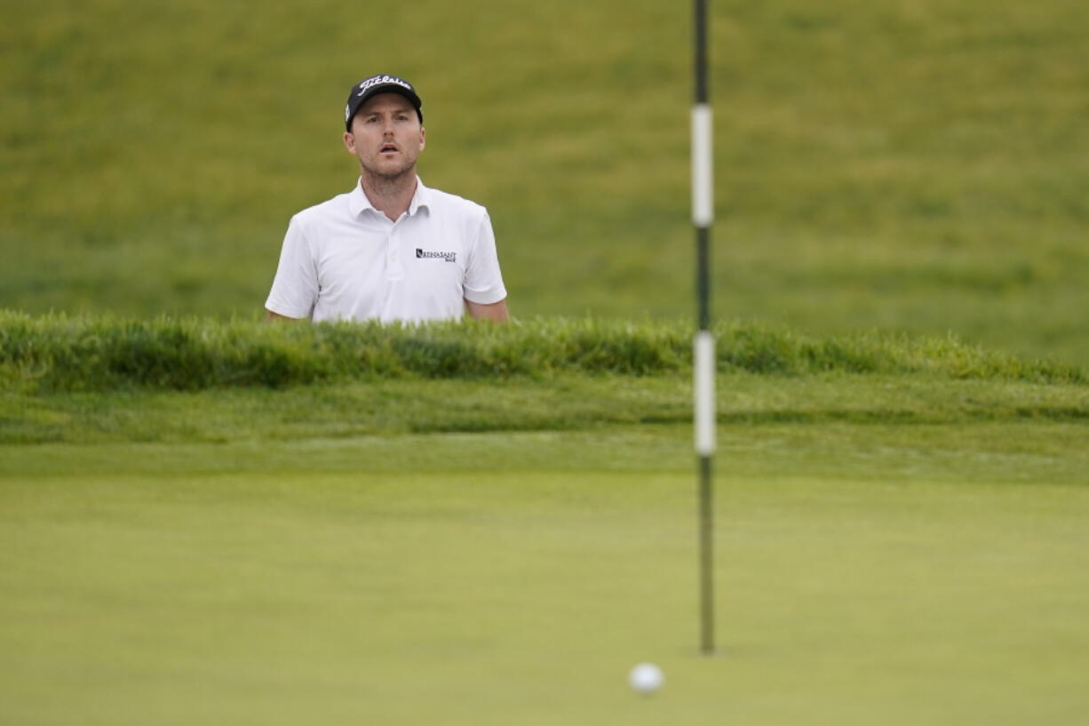 Russell Henley watches his shot on the first green roll wide of the cup during the first round of the U.S. Open Golf Championship, Thursday, June 17, 2021, at Torrey Pines Golf Course in San Diego.