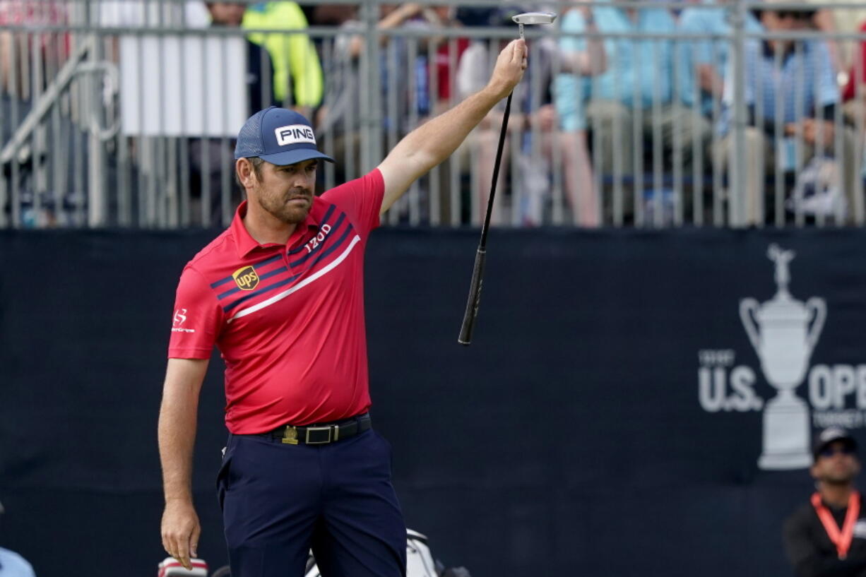 Louis Oosthuizen, of South Africa, reacts to making his eagle putt on the 18th green during the third round of the U.S. Open Golf Championship, Saturday, June 19, 2021, at Torrey Pines Golf Course in San Diego.