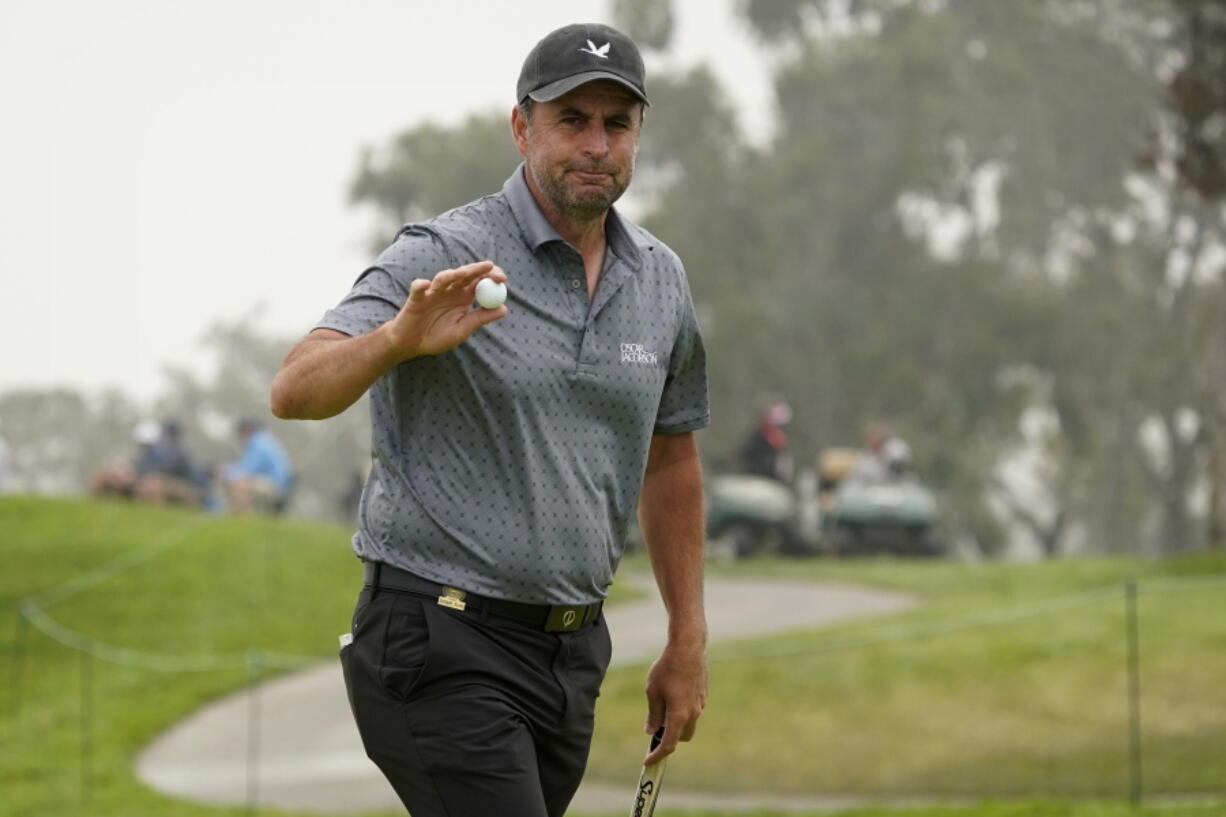 Richard Bland, of England, acknowledges the gallery after making his birdie putt on the second green during the second round of the U.S. Open Golf Championship, Friday, June 18, 2021, at Torrey Pines Golf Course in San Diego.