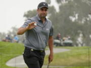 Richard Bland, of England, acknowledges the gallery after making his birdie putt on the second green during the second round of the U.S. Open Golf Championship, Friday, June 18, 2021, at Torrey Pines Golf Course in San Diego.