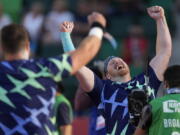 Ryan Crouser celebrates after setting a world record during the finals of men's shot put at the U.S. Olympic Track and Field Trials Friday, June 18, 2021, in Eugene, Ore.