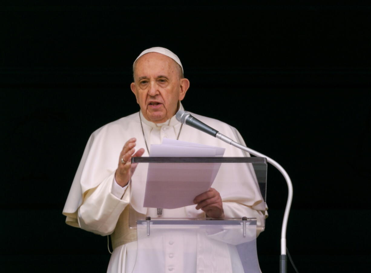 FILE - In this June 6, 2021 file photo, Pope Francis speaks from the window of his studio overlooking St. Peter's Square at the Vatican to a crowd of faithful and pilgrims gathered for the Sunday Angelus noon prayer. On Wednesday, June 30, 2021 Canada's Catholic bishops said Pope Francis has agreed to meet in December with Indigenous survivors of the country's notorious residential schools amid calls for a papal apology for Catholic Church's role in the abuse and deaths of thousands of native children.