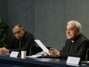 Mons. Filippo Iannone, right, and Mons. Juan Ignacio Arrieta Ochoa de Chinchetru hold a press conference to illustrate changes in the Church's Canon law, at the Vatican, Tuesday, June 1, 2021. Pope Francis has changed church law to explicitly criminalize the sexual abuse of adults by priests who abuse their authority and to say that laypeople who hold church office can be sanctioned for similar sex crimes.