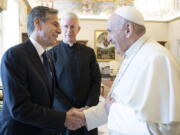 Pope Francis shakes hands with Secretary of State Antony Blinken, as they meet at the Vatican, Monday, June 28, 2021. Blinken is on a week long trip in Europe traveling to Germany, France and Italy.