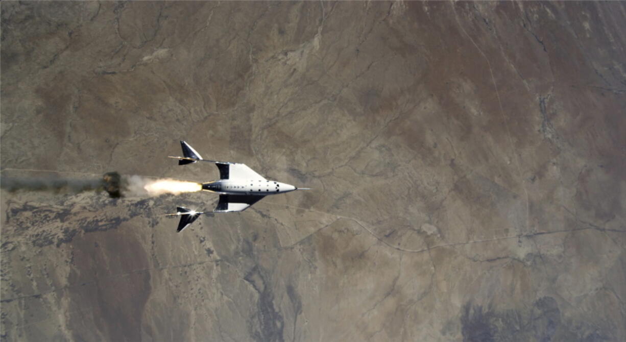 This Saturday, May 22, 2021 image provided by Virgin Galactic shows the release of VSS Unity from VMS Eve and ignition of rocket motor over Spaceport America, N.M. Virgin Galactic finally has the federal government's approval to start launching customers into space from New Mexico. Richard Branson's rocketship company announced the Federal Aviation Administration's updated license on Friday, June 25. It's the final hurdle in Virgin Galactic's years-long effort to send paying passengers on short space hops.