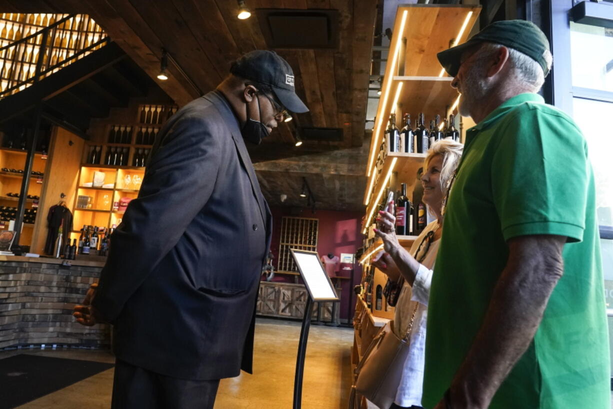 Security personnel ask customers for proof of vaccination as they enter City Winery, Thursday, June 24, 2021, in New York. Customers wanting to wine, dine and unwind to live music at the City Winery's flagship restaurant in New York must show proof of a COVID-19 vaccination to get in. But that's not required at most other dining establishments in the city. And it's not necessary at other City Winery sites around the U.S.