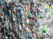 Plastic bottles are baled together for recycling, but reducing plastic use is even better, environmental advocates say.