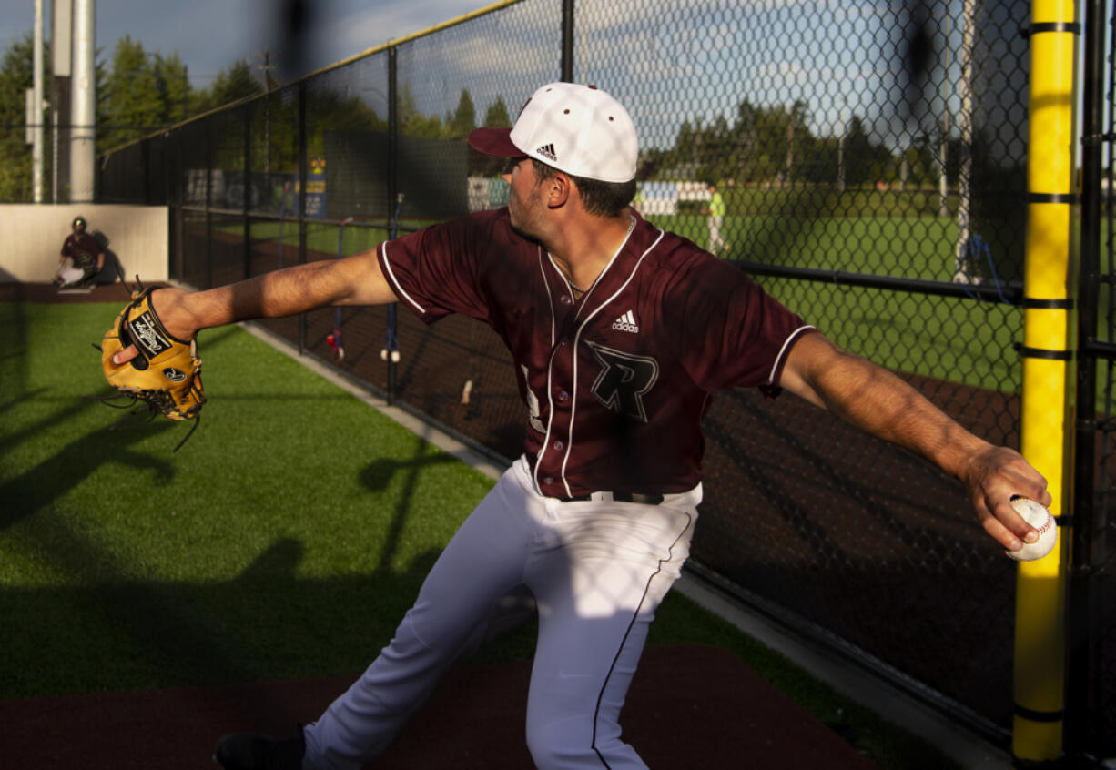 Ridgefield Raptors pitcher Nick Nygard warms up during a West Coast League game at Ridgefield Outdoor Recreation Complex. Nygard says a new grip on his slider is one factor in his success this summer.