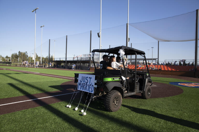 Eli Shubert, pitcher for the Ridgefield Raptors, marries Erin Thum in a short ceremony on the field before a game against the Port Angeles Lefties at Ridgefield Outdoor Recreation Complex on Wednesday, July 14, 2021.