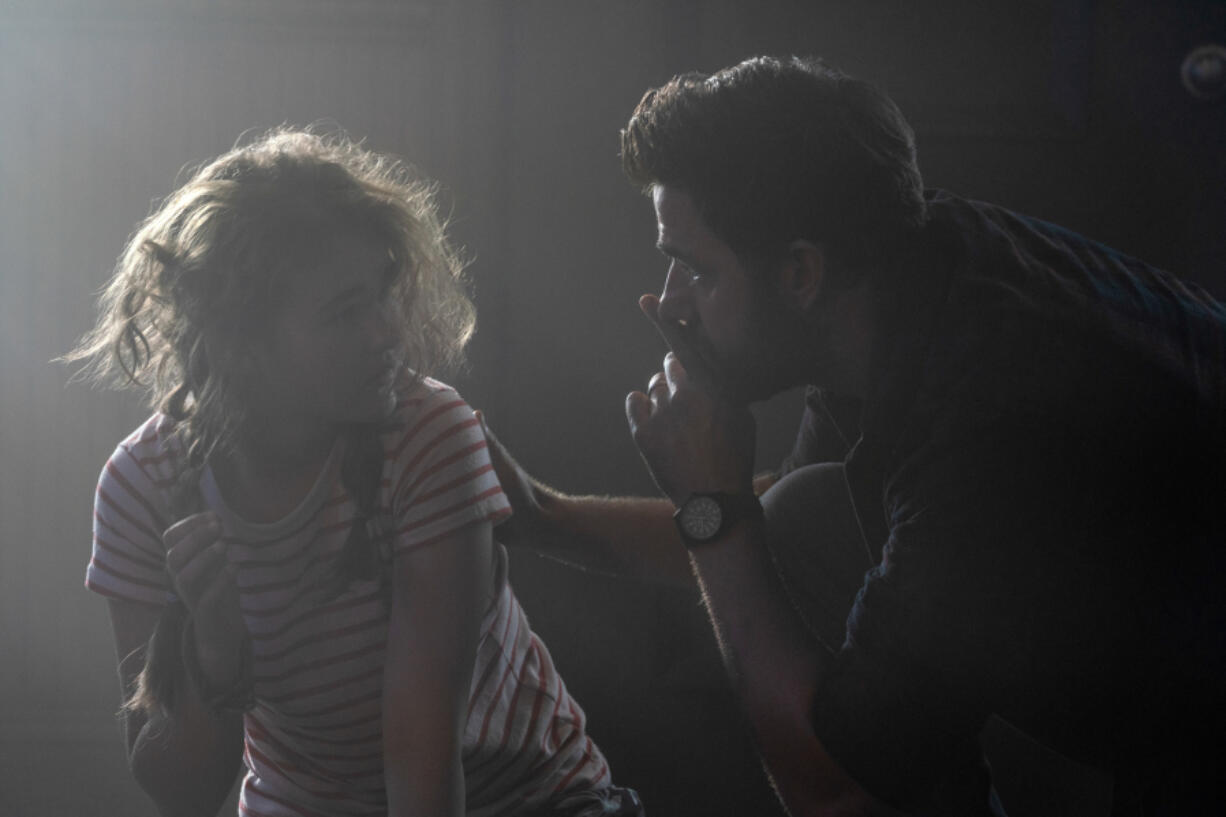 Regan (Millicent Simmonds), left, and Lee Abbott (John Krasinski) brave the unknown in "A Quiet Place Part II." (Jonny Cournoyer/Paramount Pictures/TNS)