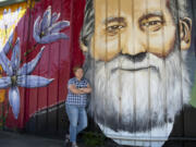 Descendant Anne Christie poses next to the face of Richard Ough, the founder of Washougal and her triple-great grandfather. "We love it," Christie said. "This is my dad's family.