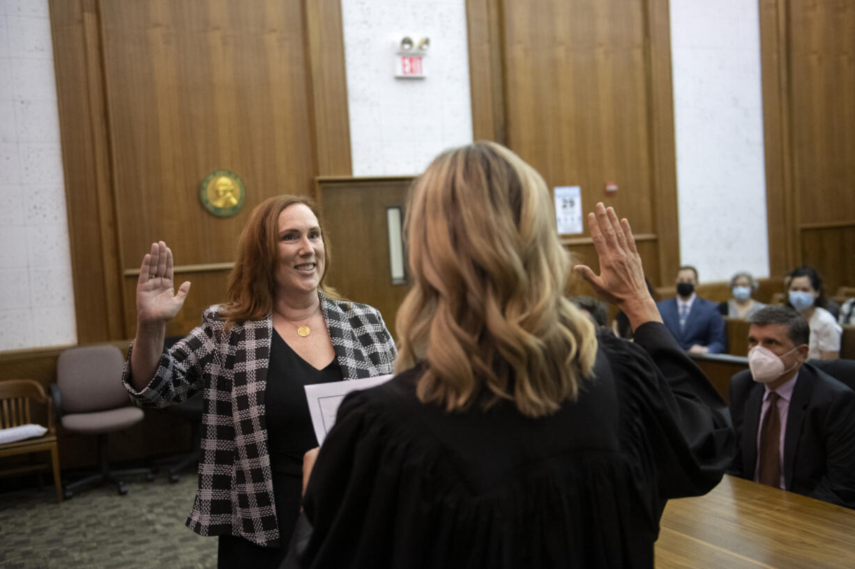 Nancy Retsinas takes the oath as Clark County Superior Court's newest judge, which was administered by Judge Jennifer Snider at the Clark County Courthouse on Thursday afternoon.