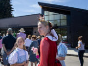 A cast of book characters helped celebrate Friday's grand opening of the new Ridgefield Community Library, including 10-year-old Iris Taylor dressed as Dorothy from the Wizard of Oz, and her sister, Guinevere Taylor, 14, dressed as the Queen of Hearts. About 500 attended the opening of the nearly 8,000-square-foot library at 210 Main Ave. in Ridgefield.