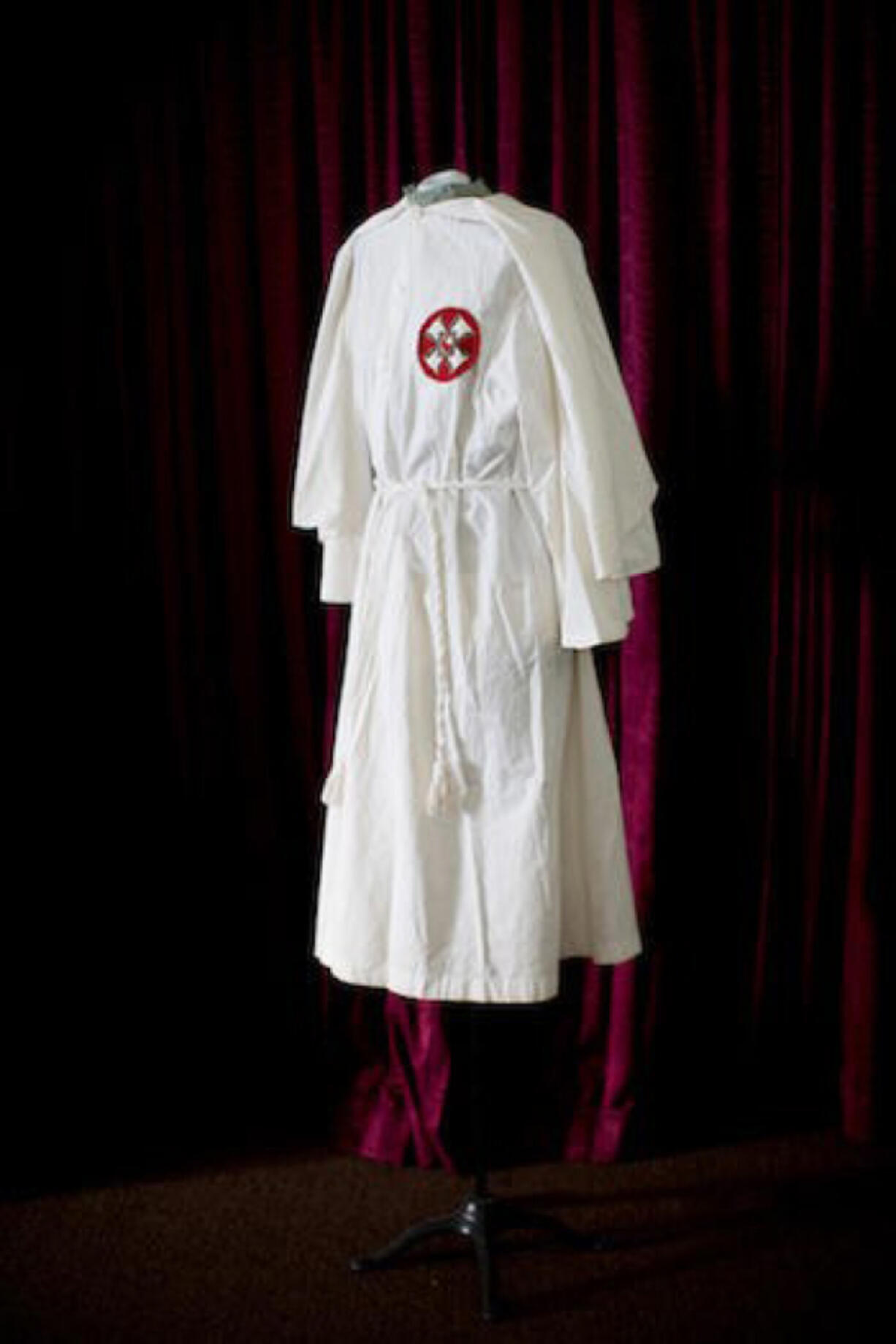 Under the guise of goodness, three members of the Columbia Klan No. 1 exploded into the Clark County Courthouse on March 11, 1921, dressed in Klan regalia like this robe from the Clatsop County Historical Museum. This was the first appearance of men sporting Klannish dress publicly in the county. Instead of firearms, they carried cash and a note stating they wanted to pay for the braces a polio-stricken boy needed. This was one of several stunts the local klavern pulled to garner favorable public opinion.