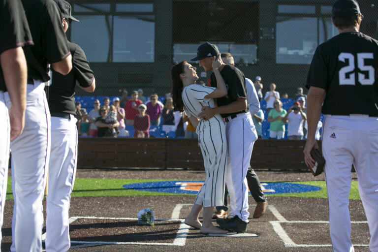 Eli Shubert, pitcher for the Ridgefield Raptors, marries Erin Thum in a short ceremony on the field before a game against the Port Angeles Lefties at Ridgefield Outdoor Recreation Complex on Wednesday, July 14, 2021.