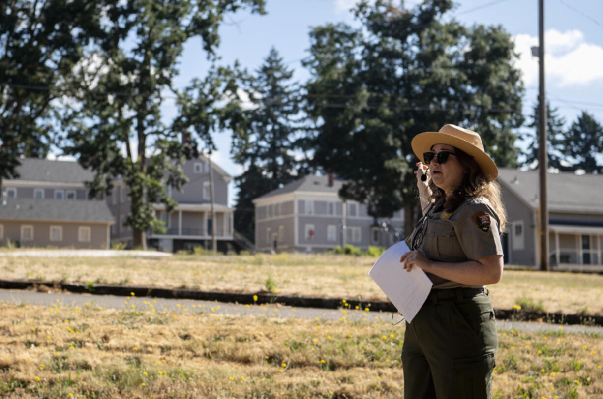 Joshua Hart/The Columbian 
 National Park Service curator Meagan Huff points toward the East Barracks on a July 17 walking tour discussing its history in the 1880s.