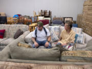 Client Jeramy Bracken shops for apartment furniture with Connie McGarry at NW Furniture Bank. As an Army veteran, Bracken qualifies to take part in the program.