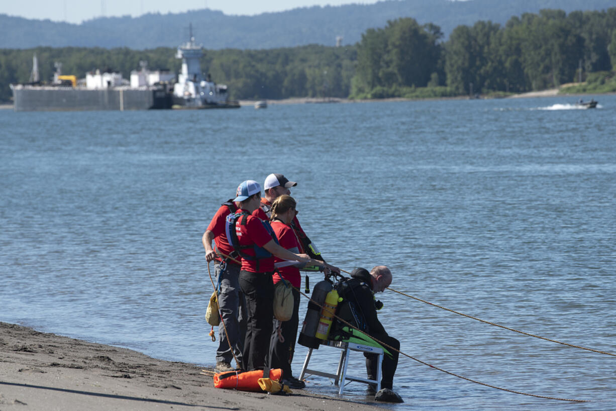 Officials work Monday morning to locate a man who is believed to have drowned near the Columbia River Frenchman's Bar Regional Park on Sunday evening. He was not wearing a life jacket and was not a strong swimmer, according to the Vancouver Fire Department.