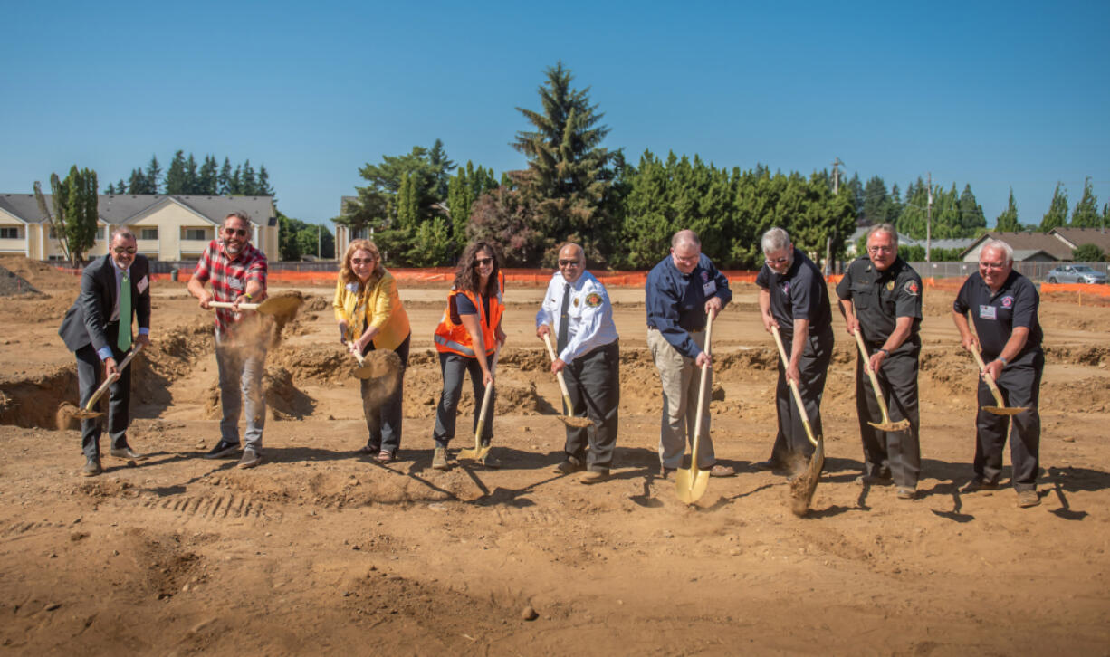 ORCHARDS: From left is City Manager Eric Holmes, City Councilor Erik Paulsen, Mayor Anne McEnerny-Ogle, Capital Projects Manager Jean Singer, Fire Chief Brennan Blue, Clark County Fire District 5 Commissioner Mike Lyons.