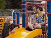 Vancouver Parks and Recreation staff member Karen Miller talks with Hayden Rider, 18, at an Access to Recreation camp at Lieser Elementary School in Vancouver. The camps for individuals with special needs are back on this summer after the pandemic forced a hiatus in 2020.