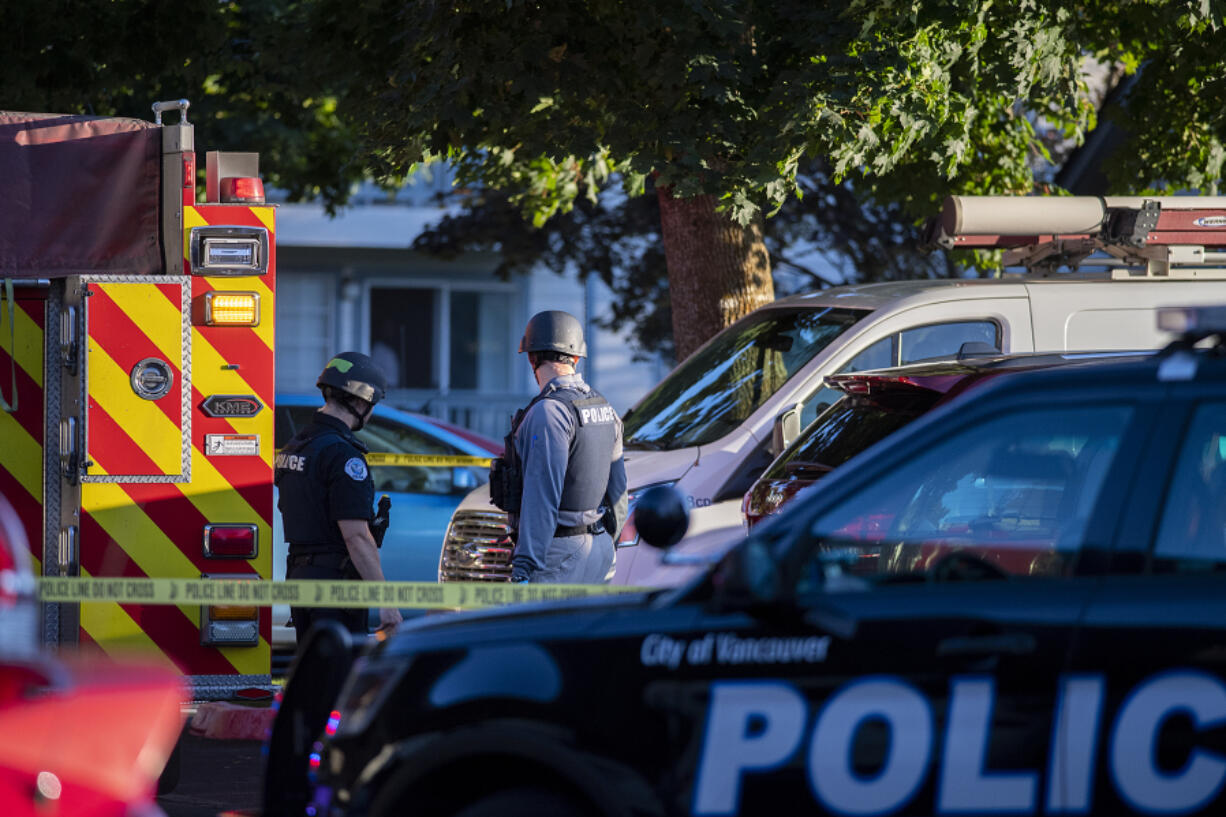 Law enforcement officers investigate the scene of a reported shooting at The Pointe Apartments on Friday evening.