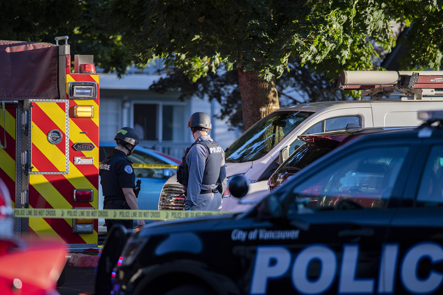 Law enforcement officers investigate the scene of a reported shooting at The Pointe Apartments on Friday evening.