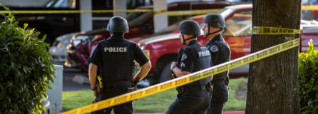 Law enforcement officers investigate the scene of a reported shooting at The Pointe Apartments on Friday evening, July 23, 2021.