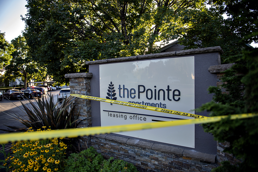 Law enforcement officers investigate the fatal shooting of Clark County sheriff's Detective Jeremy Brown at The Pointe Apartments on Friday evening.