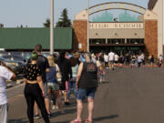 Hundreds wait in line at Evergreen Public Schools' surplus sale at Evergreen High School on Friday morning. The one-day event was open to the public featuring old and outdated items from electronics to vehicles to purchase at discounted prices.