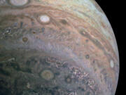 A Juno space probe passed below Jupiter and took this photograph of the giant planet's cloud bands on April 10, 2020.