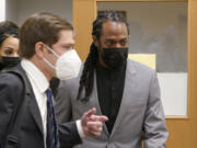 NFL football player Richard Sherman, right, heads into a hearing at King County District Court with his attorney Cooper Offenbecher, Friday, July 16, 2021, in Seattle. Prosecutors in Washington state have charged Sherman, who has played for the Seattle Seahawks and the San Francisco 49ers NFL football teams, after police said he drunkenly crashed his SUV in a construction zone and tried to break into his in-laws' home. (AP Photo/Ted S.