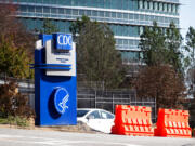 FILE - This March 6, 2020, file photo, shows the headquarters for Centers for Disease Control and Prevention in Atlanta. The nation’s top health agency is expected to backpedal on its masking guidelines and recommend that even vaccinated people wear masks indoors in parts of the U.S. where the coronavirus is surging, according to a federal official who spoke on condition of anonymity because the official was not authorized to release the data. The Centers for Disease Control and Prevention is expected to make an announcement Tuesday, July 27, 2021.