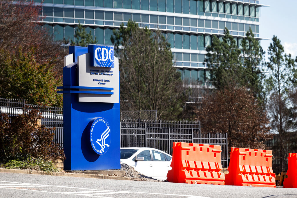 FILE - This March 6, 2020, file photo, shows the headquarters for Centers for Disease Control and Prevention in Atlanta. The nation’s top health agency is expected to backpedal on its masking guidelines and recommend that even vaccinated people wear masks indoors in parts of the U.S. where the coronavirus is surging, according to a federal official who spoke on condition of anonymity because the official was not authorized to release the data. The Centers for Disease Control and Prevention is expected to make an announcement Tuesday, July 27, 2021.