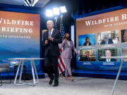 President Joe Biden and Vice President Kamala Harris arrive for a meeting with governors to discuss ongoing efforts to strengthen wildfire prevention, preparedness and response efforts, and hear firsthand about the ongoing impacts of the 2021 wildfire season in the South Court Auditorium in the Eisenhower Executive Office Building on the White House Campus in Washington, Friday, July 30, 2021.