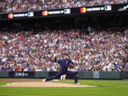 American League's starting pitcher Shohei Ohtani, of the Los Angeles Angeles, throws during the first inning of the MLB All-Star baseball game, Tuesday, July 13, 2021, in Denver.