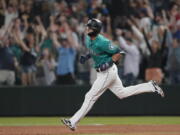 Seattle's Mitch Haniger rounds the bases after he hit a grand slam during the eighth inning Friday against the Los Angeles Angels.