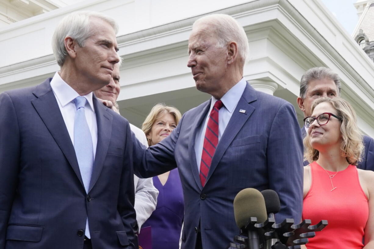 President Joe Biden speaks with Sen. Rob Portman, R-Ohio, and other bipartisan group of senators, Thursday June 24, 2021, outside the White House in Washington. Biden invited members of the group of 21 Republican and Democratic senators to discuss the infrastructure plan. From left are Portman, Sen. Bill Cassidy, R-La., Sen. Lisa Murkowski, R-Alaska, Biden, Sen, Joe Manchin, D-W.Va., rear, and Sen. Kyrsten Sinema.