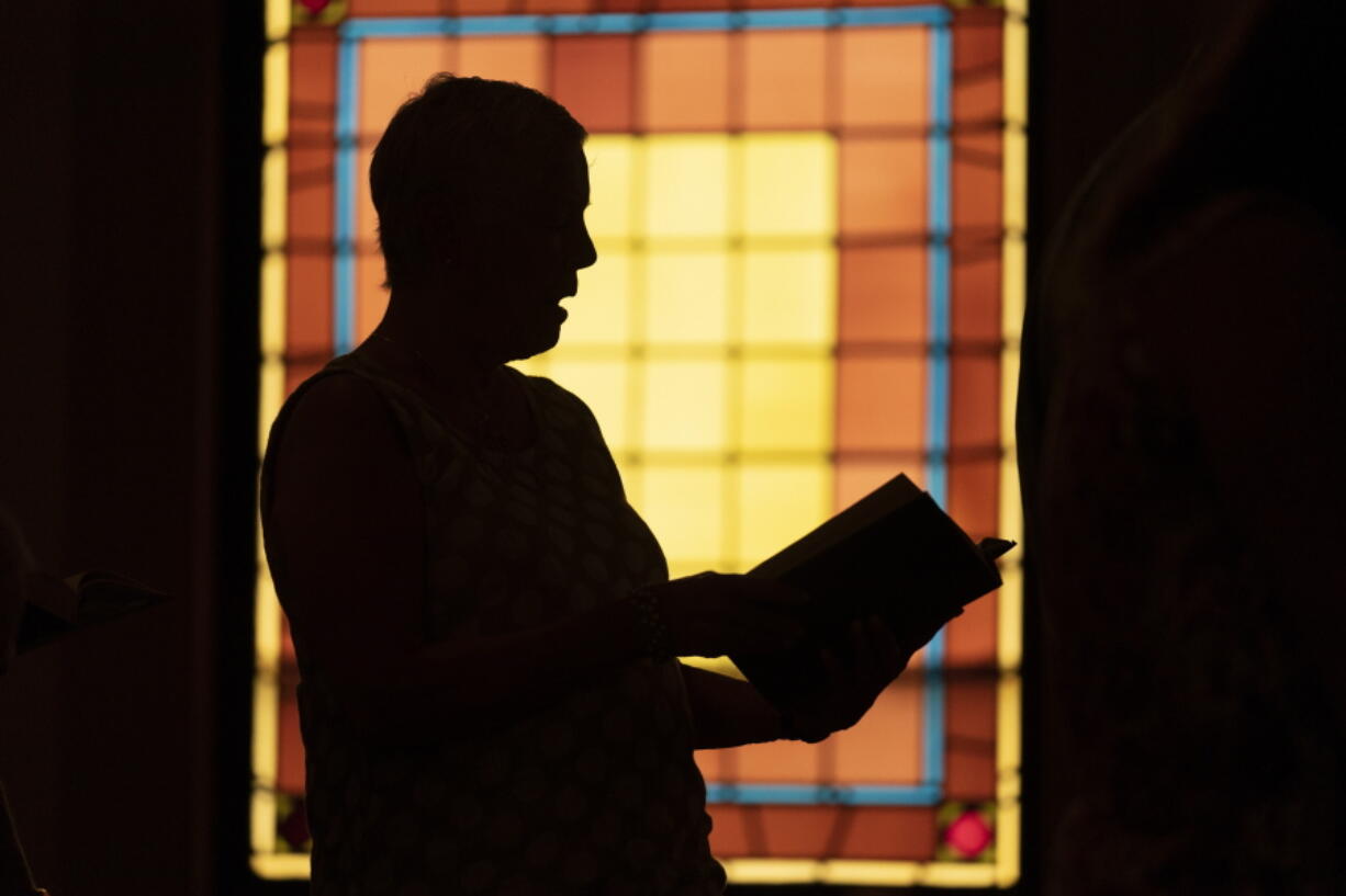 A member of Waldoboro United Methodist Church sings a hymn during a service, Sunday, June 20, 2021, in Waldoboro, Maine. The drop in attendance at the church, in part due to COVID-19, forced its closure. The last sermon was on June 27. (AP Photo/Robert F. Bukaty) (Robert F.