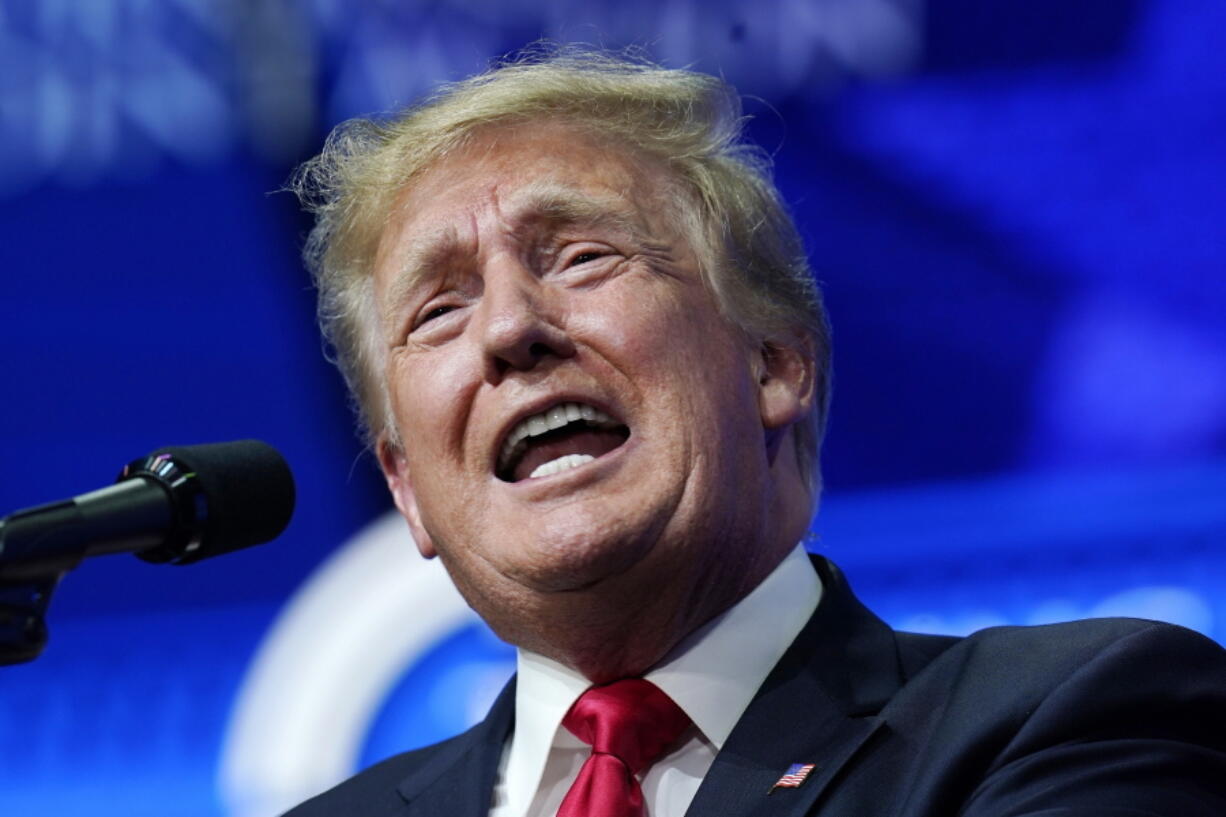 FILE - In this Saturday, July 24, 2021, file photo former President Donald Trump speaks on a variety of topics to supporters at a Turning Point Action gathering in Phoenix.  Trump urged senior Justice Department officials to declare the 2020 election results "corrupt" in a December phone call. That's according to handwritten notes from one of the participants in the conversation. The notes of the Dec. 27 call were released Friday by the Democratic-led House Oversight Committee.  (AP Photo/Ross D.