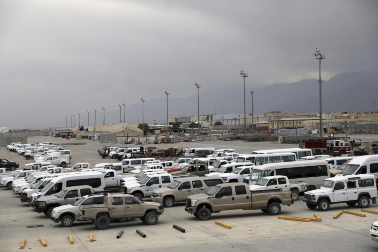 Vehicles are parked at Bagram Airfield after the American military left the base, in Parwan province north of Kabul, Afghanistan, Monday, July 5, 2021. The U.S. left Afghanistan's Bagram Airfield after nearly 20 years, winding up its "forever war," in the night, without notifying the new Afghan commander until more than two hours after they slipped away.